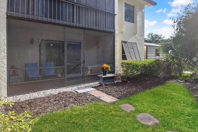 exterior space featuring a sunroom and a balcony