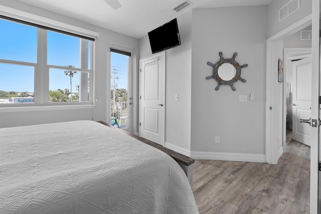 12 13th St, Saint Augustine Beach, FL 32080 - bedroom with ceiling fan, baseboards, and wood finished floors