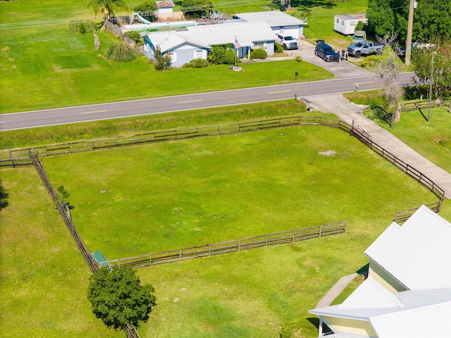 birds eye view of property featuring a rural view