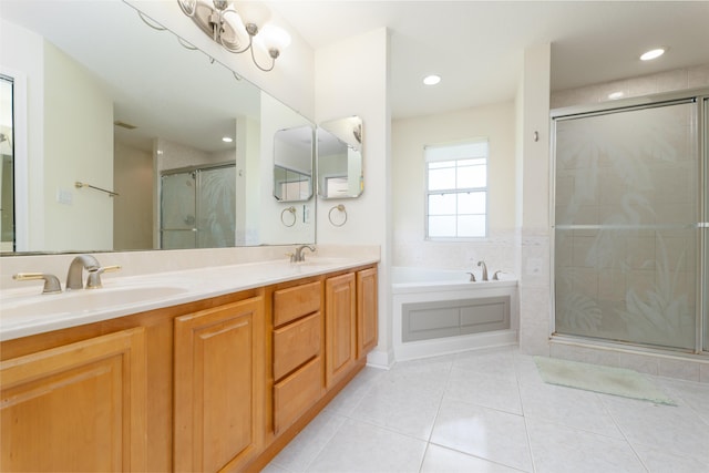 bathroom with tile patterned floors, vanity, and independent shower and bath