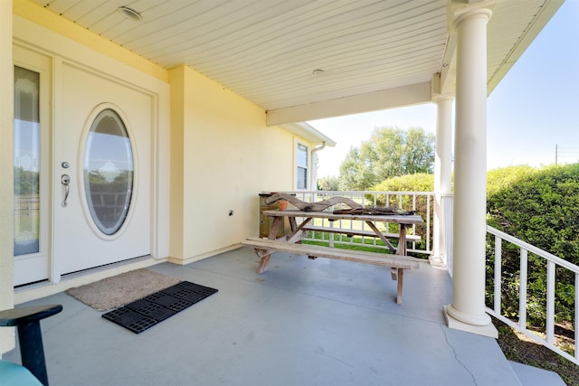 doorway to property with a porch