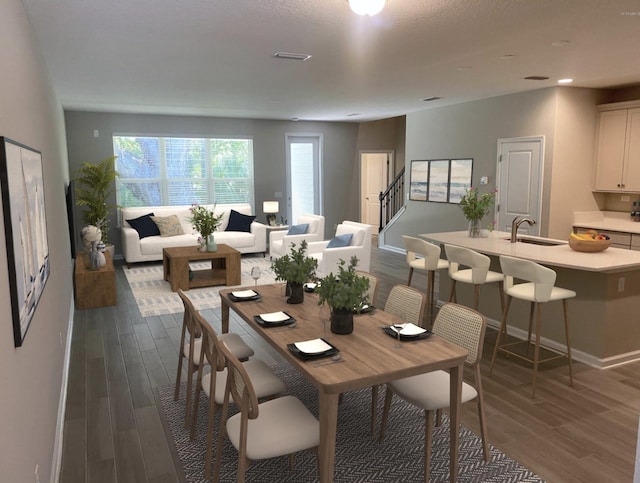 dining area featuring dark hardwood / wood-style flooring and sink