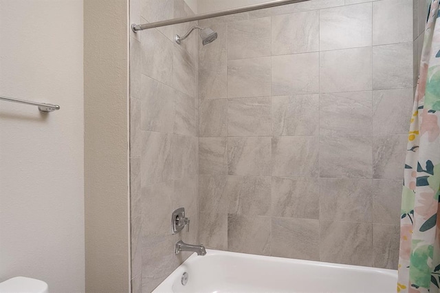 bathroom featuring shower / tub combo with curtain and toilet