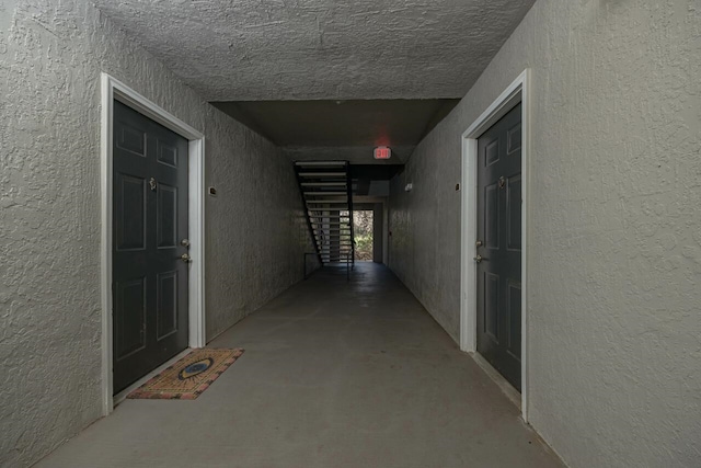 hall with concrete flooring