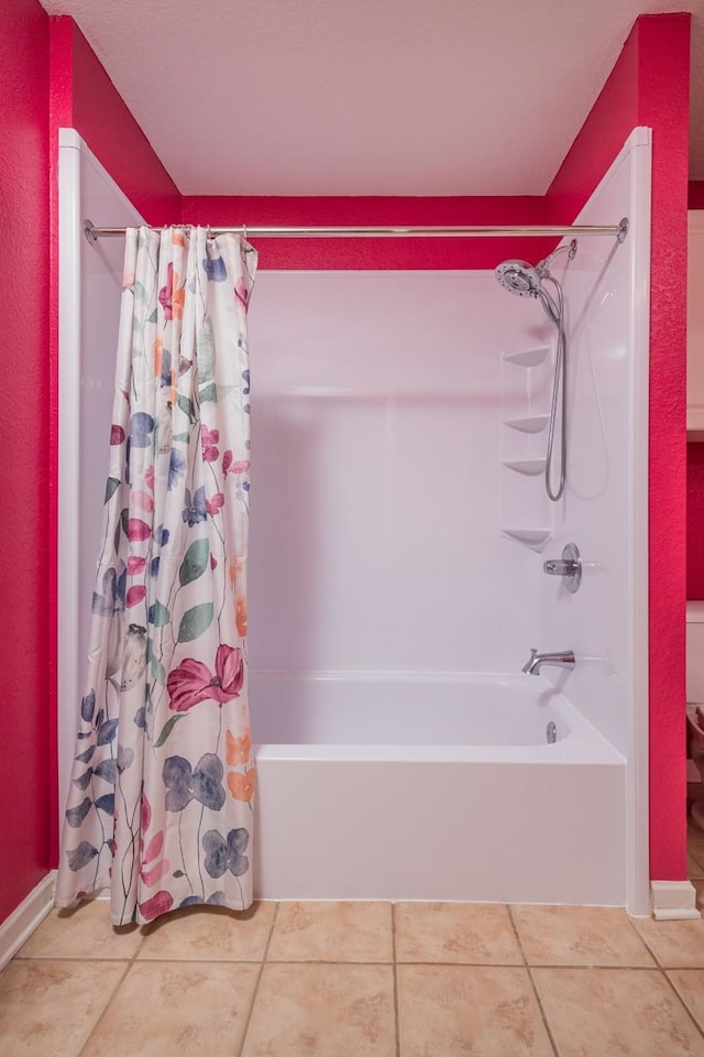 bathroom featuring tile patterned flooring and shower / bath combo