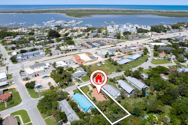 birds eye view of property with a water view