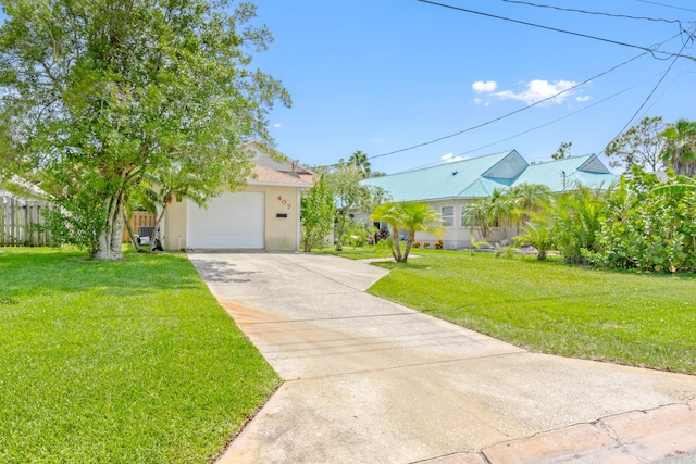 view of front facade featuring a garage and a front yard