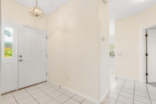 foyer featuring light tile patterned flooring