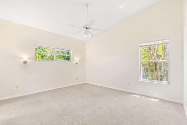 spare room with ceiling fan, carpet, and lofted ceiling