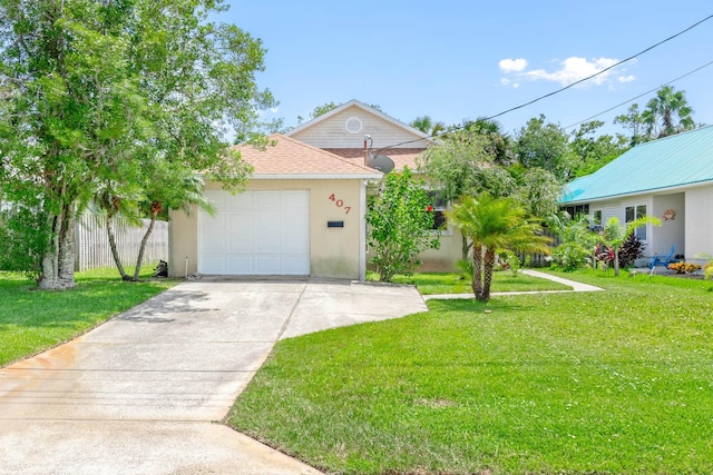 view of front facade with a garage and a front yard