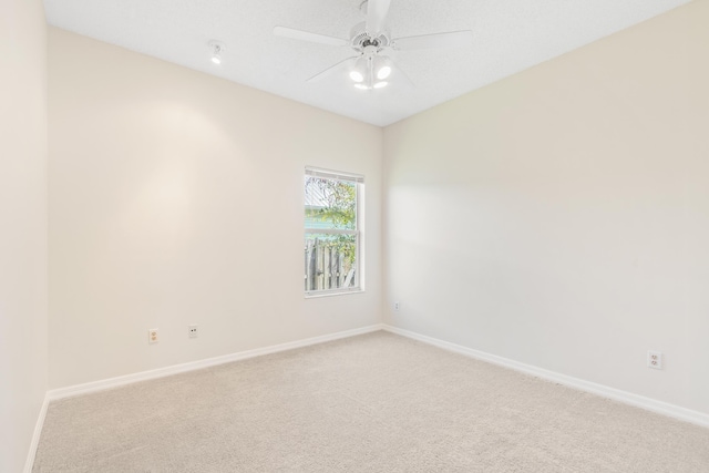 unfurnished room featuring carpet floors and ceiling fan