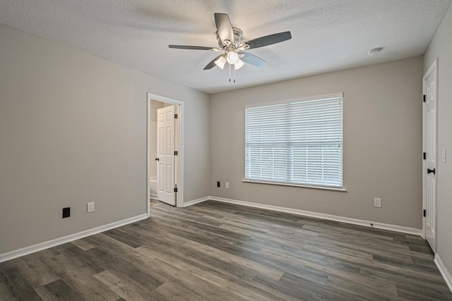 spare room featuring a textured ceiling, dark hardwood / wood-style floors, and ceiling fan