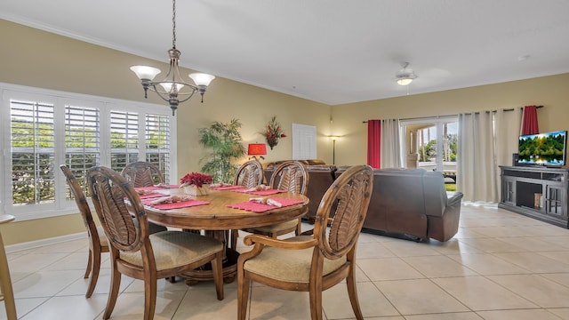 264 Gibraltar Ct Unit 101, Saint Augustine, FL 32080 - dining space featuring plenty of natural light, a chandelier, light tile patterned floors, and ornamental molding