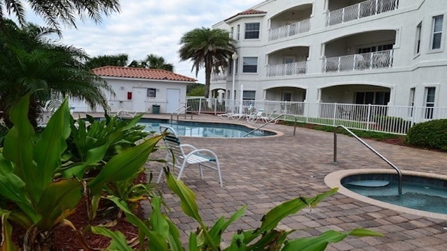 264 Gibraltar Ct Unit 101, Saint Augustine, FL 32080 - community pool featuring a patio area and a community hot tub