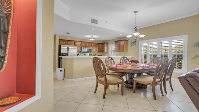 264 Gibraltar Ct Unit 101, Saint Augustine, FL 32080 - dining area featuring a chandelier, crown molding, light tile patterned flooring, recessed lighting, and baseboards
