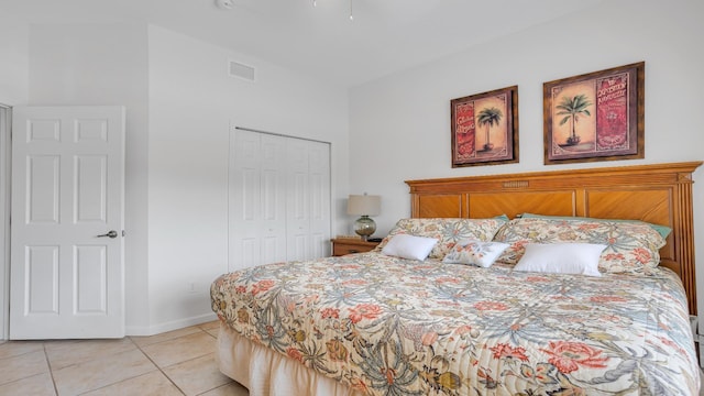 264 Gibraltar Ct Unit 101, Saint Augustine, FL 32080 - bedroom with light tile patterned floors, a closet, and baseboards