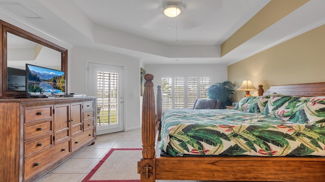 264 Gibraltar Ct Unit 101, Saint Augustine, FL 32080 - bedroom with access to outside, a tray ceiling, light tile patterned floors, and ceiling fan