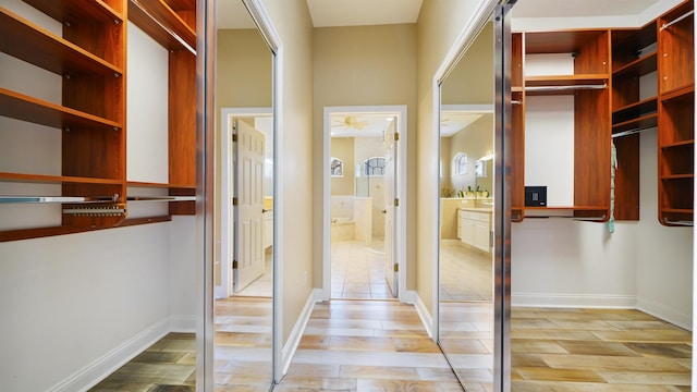 spacious closet featuring light hardwood / wood-style flooring