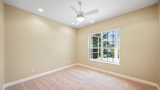 carpeted empty room with ceiling fan