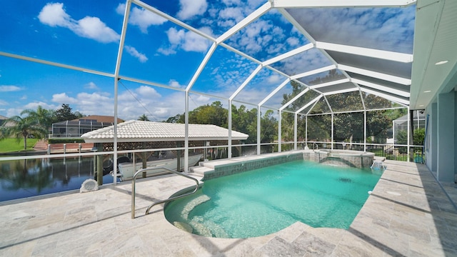 view of pool with glass enclosure and a patio area