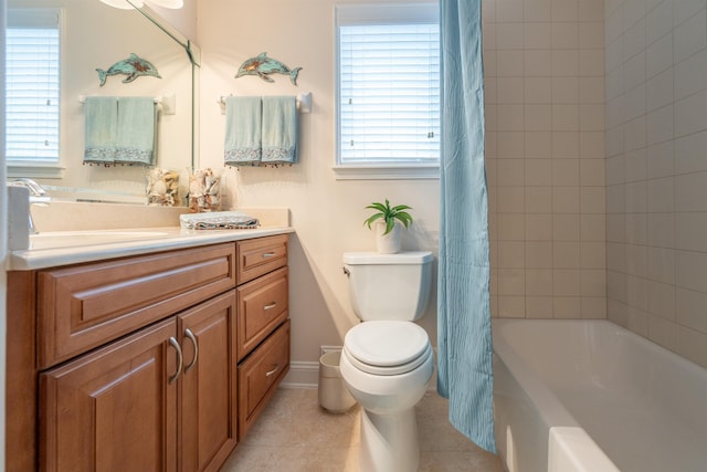 full bathroom featuring vanity, tile patterned floors, toilet, and shower / tub combo with curtain