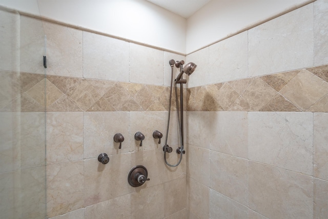 bathroom with tiled shower