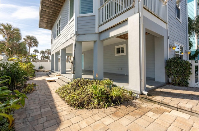 view of side of property featuring a balcony