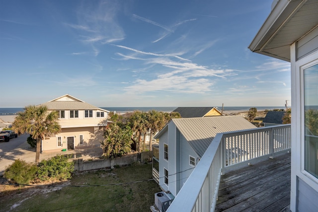 wooden deck with a water view