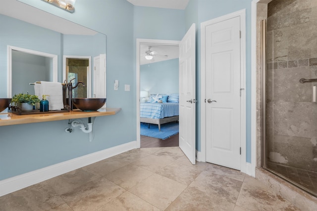 bathroom featuring sink and an enclosed shower