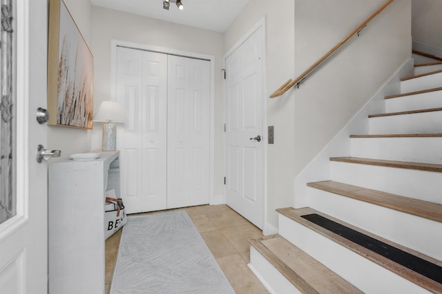 entrance foyer featuring light tile patterned floors