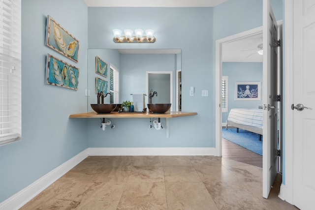 bathroom featuring tile patterned flooring and a wealth of natural light