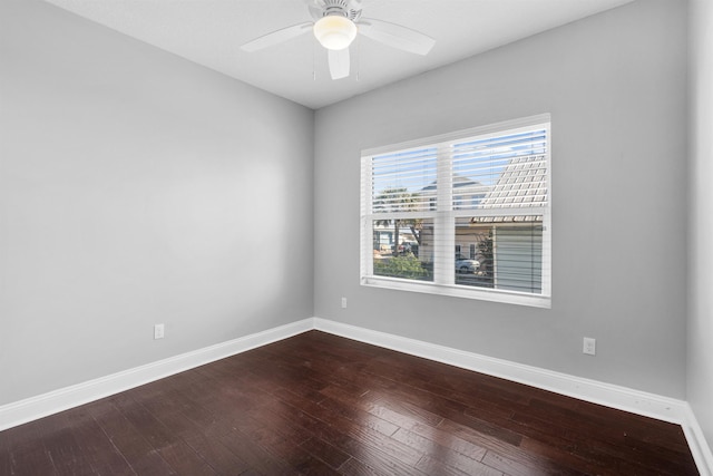 spare room with hardwood / wood-style flooring and ceiling fan