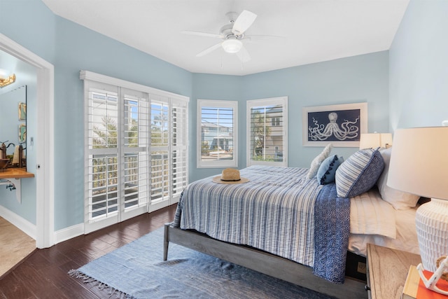 bedroom featuring dark wood-type flooring and ceiling fan