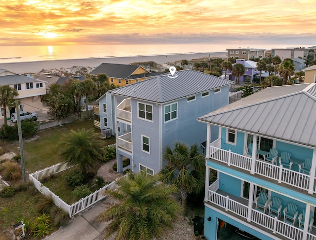 aerial view at dusk with a water view