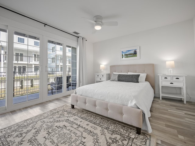 bedroom featuring ceiling fan, access to outside, and hardwood / wood-style flooring