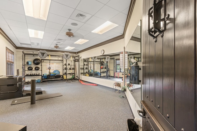 workout area featuring a paneled ceiling