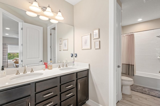 full bathroom with toilet, vanity, and shower / tub combo with curtain