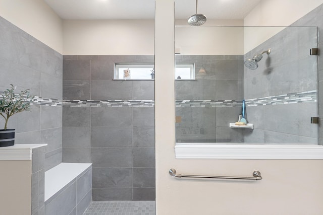 bathroom featuring a tile shower