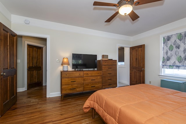 bedroom featuring dark wood-type flooring and ceiling fan