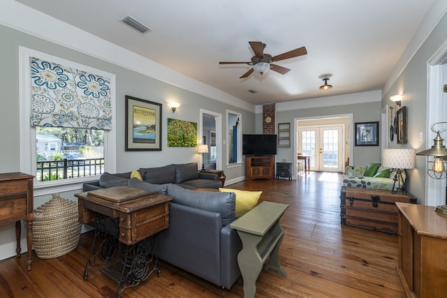 living room featuring french doors, ceiling fan, and wood-type flooring