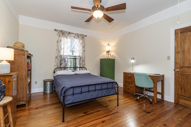 bedroom with wood-type flooring and ceiling fan