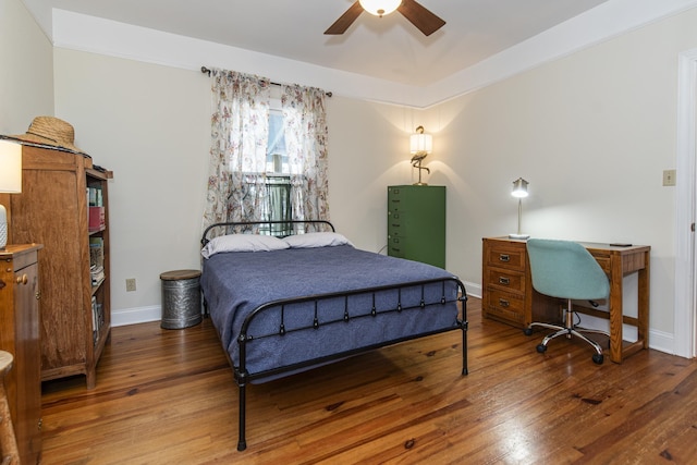 bedroom featuring hardwood / wood-style flooring and ceiling fan