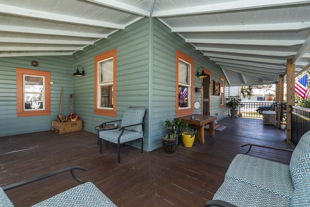 wooden terrace featuring covered porch