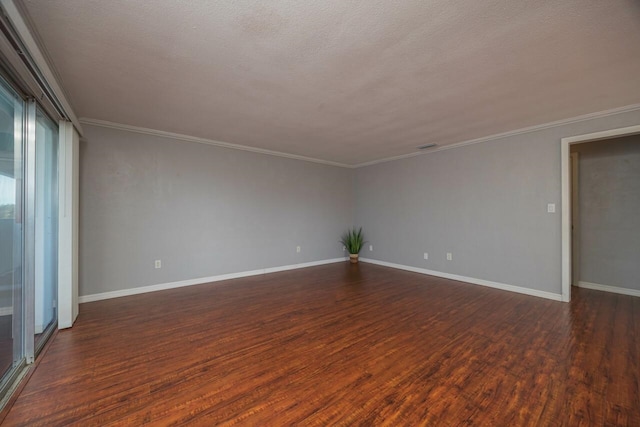 unfurnished room featuring ornamental molding, dark hardwood / wood-style flooring, and a textured ceiling