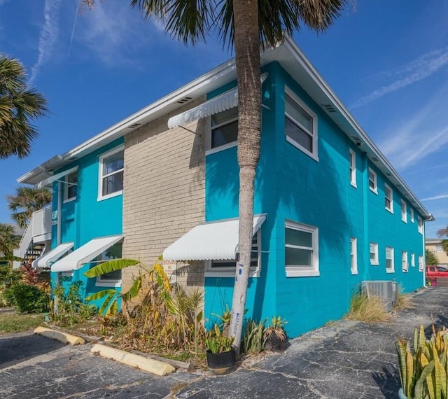 view of property exterior with central air condition unit