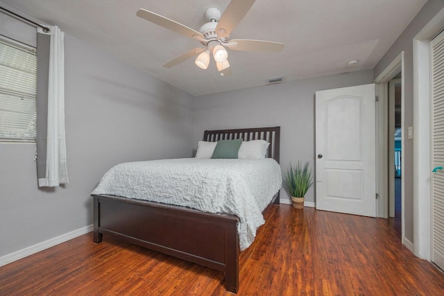 bedroom featuring dark wood-type flooring and ceiling fan