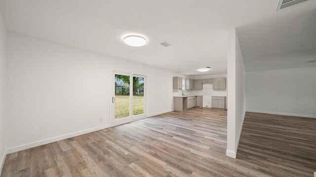 unfurnished living room featuring light hardwood / wood-style flooring