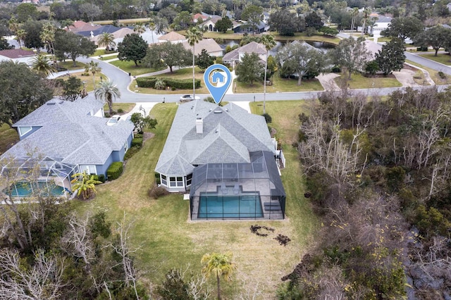 birds eye view of property with a residential view