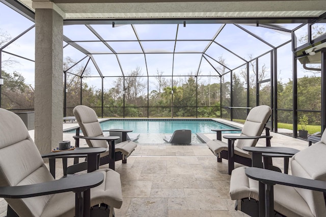 outdoor pool with a patio and a lanai