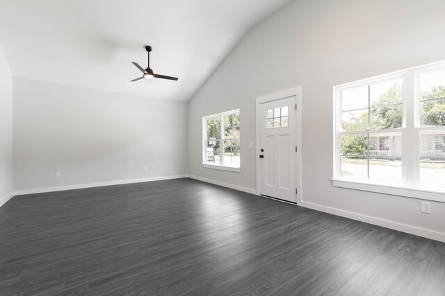 foyer entrance featuring ceiling fan, plenty of natural light, high vaulted ceiling, and dark wood-type flooring